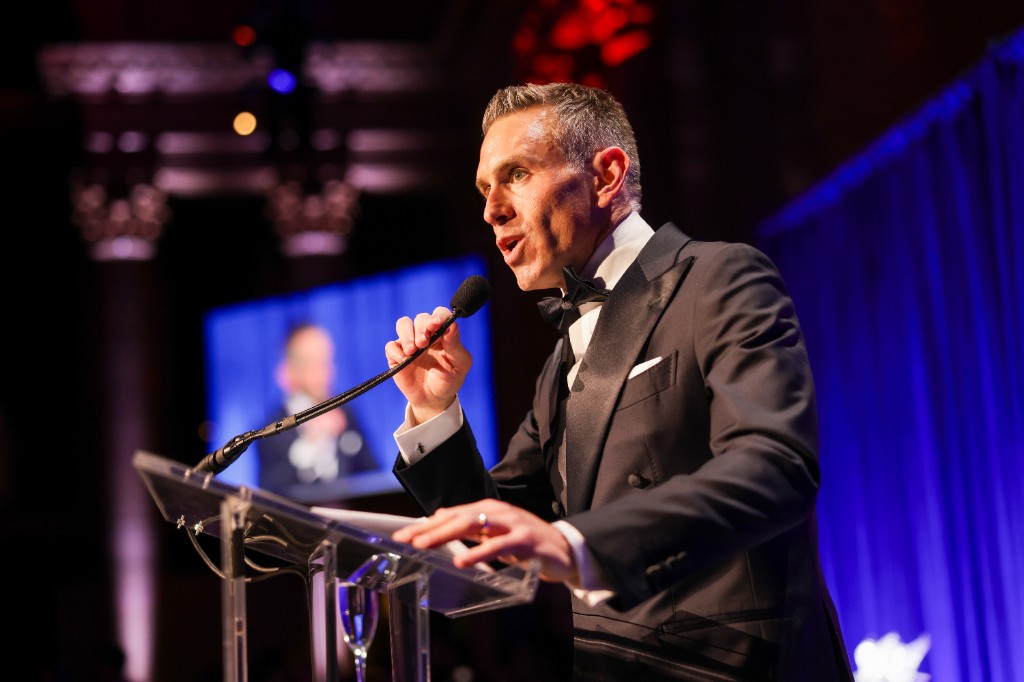 Jason D. Meister speaking at a formal event